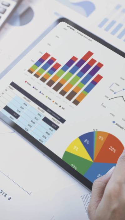 Businesswoman using a tablet to analysis graph company finance s Businesswoman using a tablet to analysis graph company finance strategy statistics success concept and planning for future in office room.